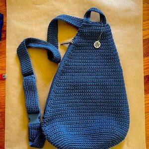 The Sak Geo Sling Crochet Sling Bag One Strap Backpack in Maritime Dusty Blue